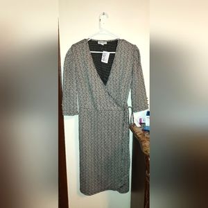 Wrap around dress. Black and white with gold accents. New with tag!